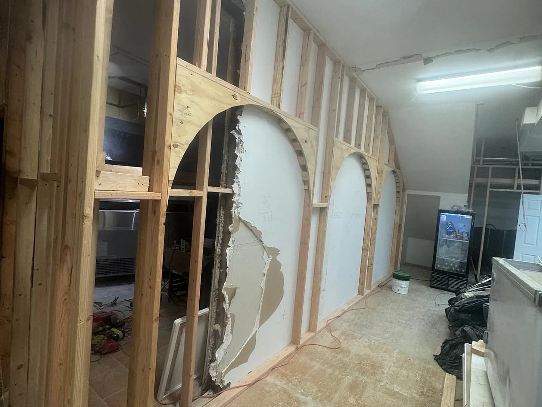 Framed arches part-boarded and skimmed as the interior moves to finishing